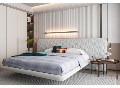 Moderní bílá čalouněná postel v minimalistickém kulatém designu