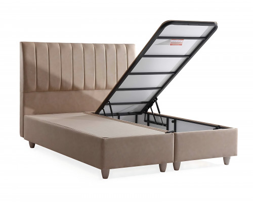 Postel z béžového materiálu s elegantní matrací