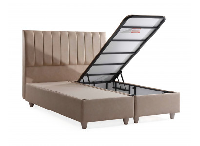 Postel z béžového materiálu s elegantní matrací