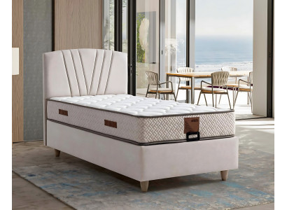 Elegantní postel s matrací v béžovém materiálu