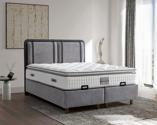 Elegantní a stabilní postel s matrací vnáší kouzlo do interiéru.