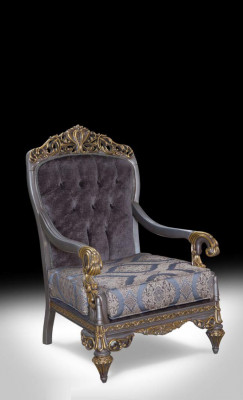 Elegantní klasické křeslo s dekorativními vzory v designu Chesterfield.