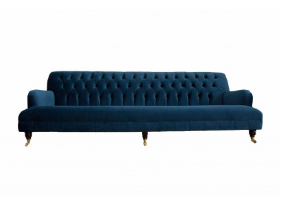 Luxusní designová pohovka v Chesterfieldském stylu s čtyřmi sedadly v modré barvě.