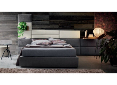 Dvojlůžkové postele v luxusním designu s polstrováním pro manželskou postel o rozměrech 180x200 cm ve dřevěné ložnici.