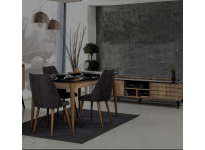 Jídelní skupina designéra hnědý jídelní stůl 4x černé čalouněné židle.
