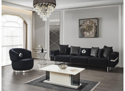 Moderní obývací pokoj s černou sedačkou, černým křeslem a novým stolkem.