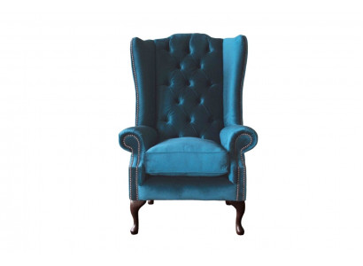Šedá křeslo s ušima Chesterfield design čalouněný textilní obývací pokoj.