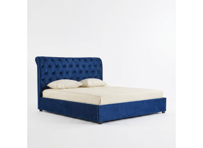 Modré lůžko Chesterfield pro manželskou postel, luxusní ložnice, čalounená postel.