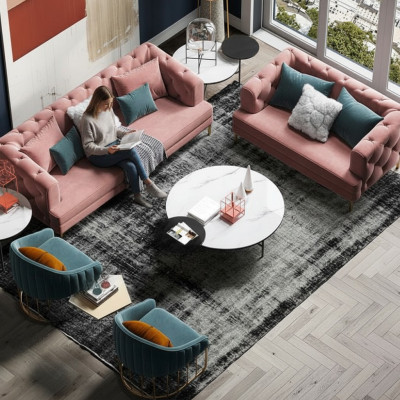 Tříkřeselná relaxační designová pohovka s loungovým textilním potahem.