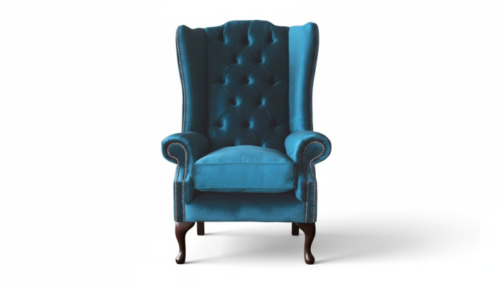Šedá křeslo s ušima Chesterfield design čalouněný textilní obývací pokoj.