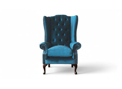Šedá křeslo s ušima Chesterfield design čalouněný textilní obývací pokoj.